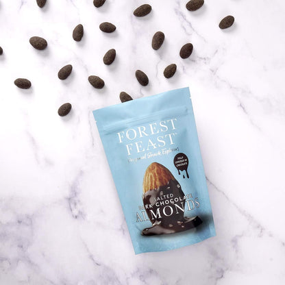 opened pack of Forest Feast Salted Dark Chocolate Almonds Chocolate with the almonds falling out