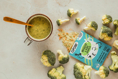 A cooked Cupster instant broccoli - kale cream soup 10 pack with the packed showing the dried contents