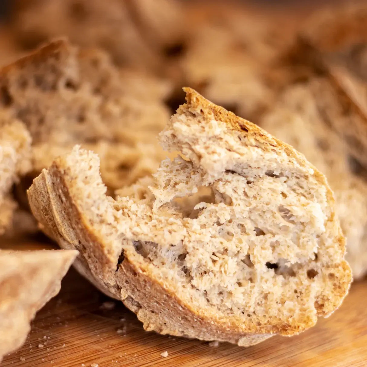 Close-up of a slice of bread on a wooden surface of Mills & Folks - Bake-Free Home-made Low-carb Sorghum Bread Flour Mixture 900g