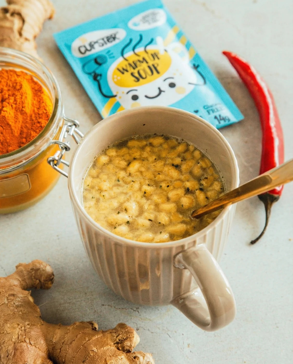 A beige ceramic mug filled with Cupster instant turkish red lentil creamsoup
