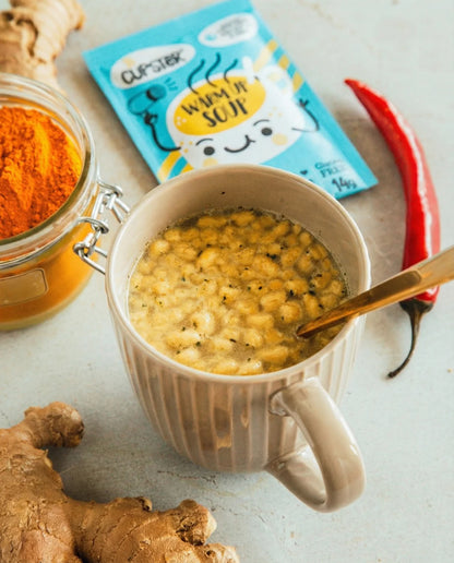 A beige ceramic mug filled with Cupster instant turkish red lentil creamsoup